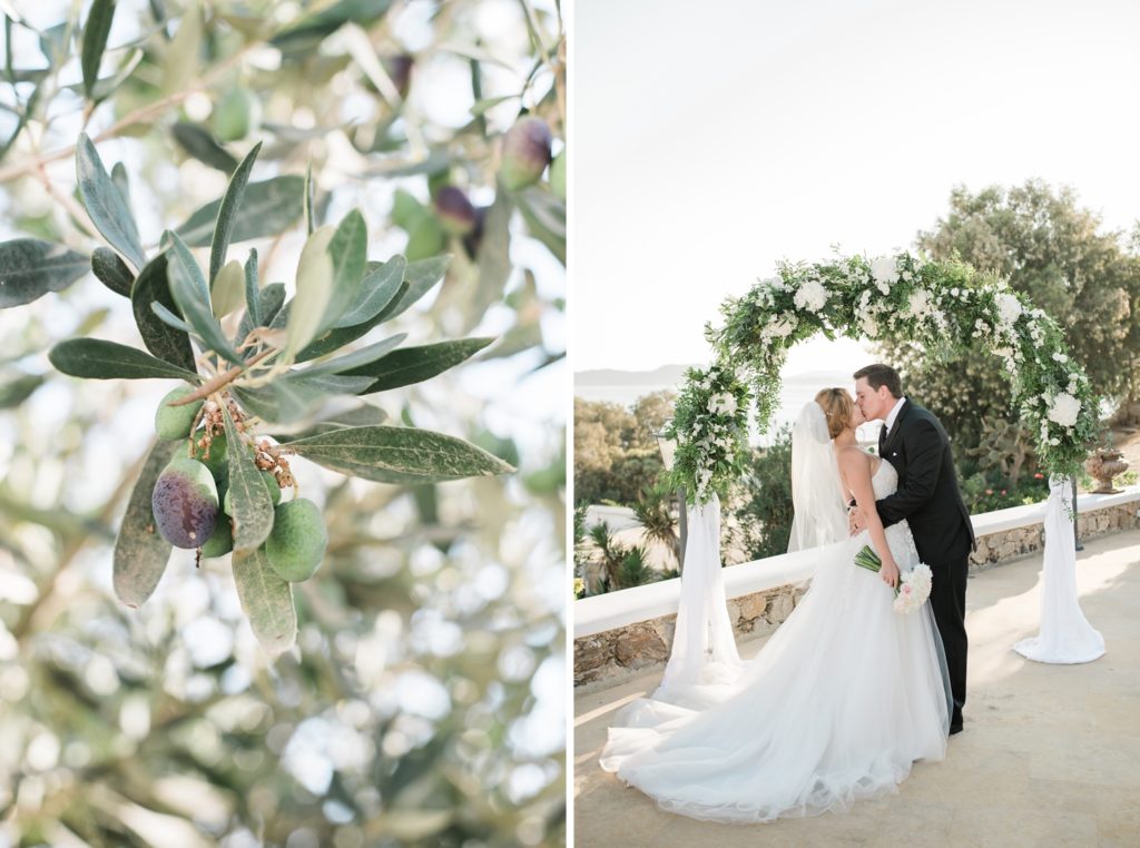 Serene moment of bride and groom kiss at a Greek villa wedding