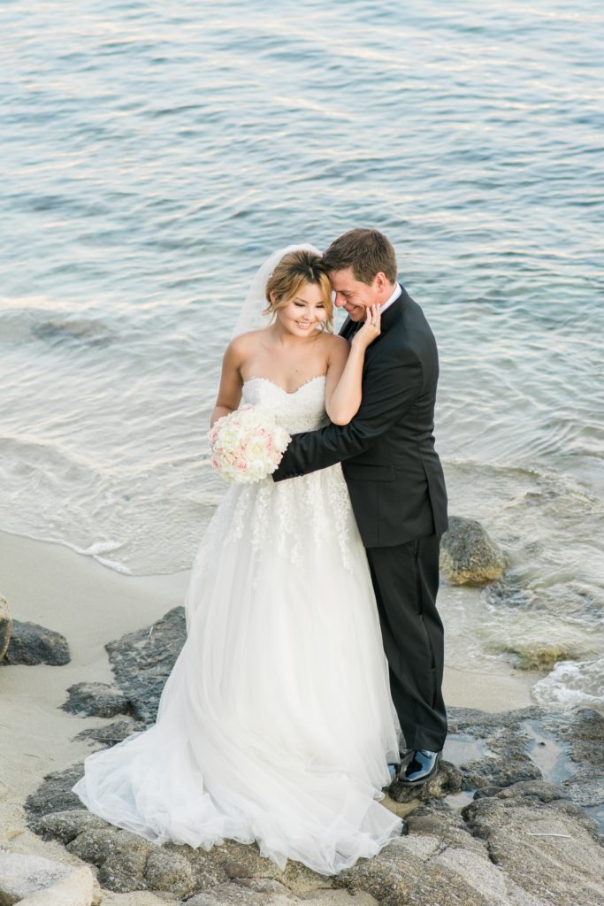 Romantic bride and groom portrait on a beach in Greece