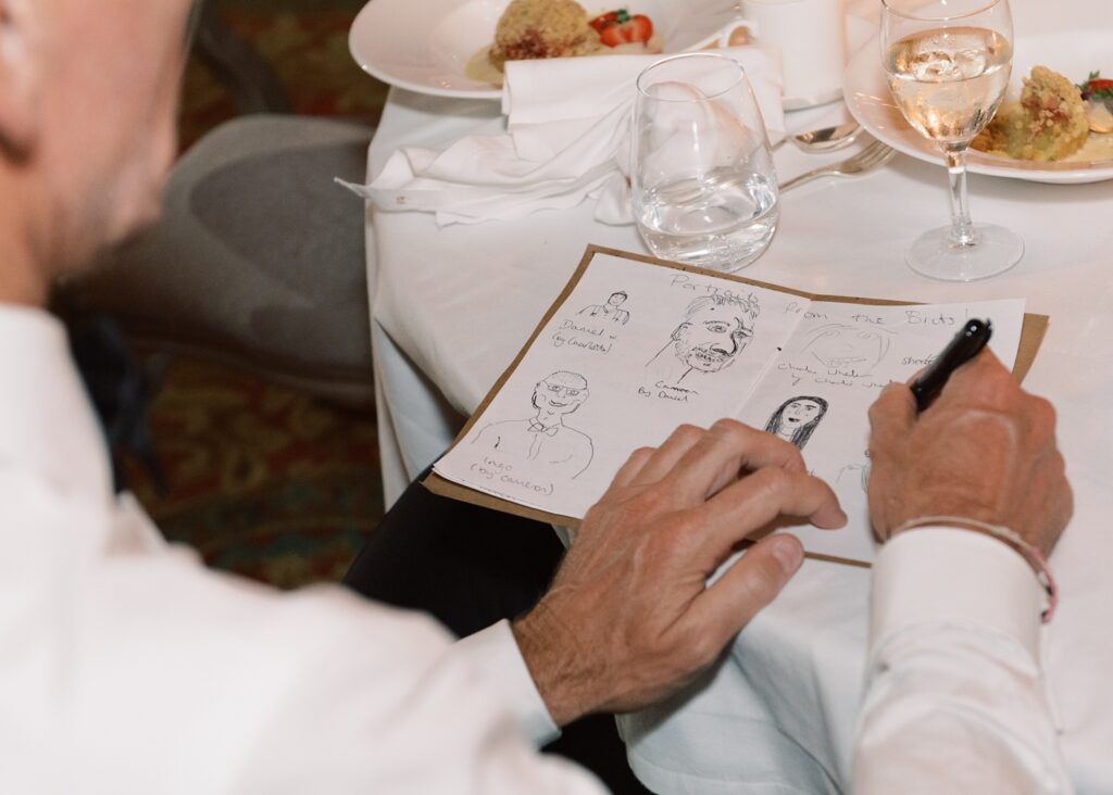 Funny moments with guests drawing a card during wedding celebration in Dromoland Castle Hotel.