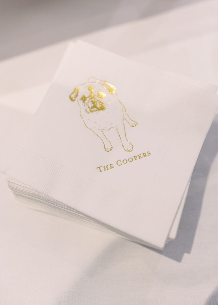 Special wedding napkins marked 'The Coopers', styled after their Pug Ronnie