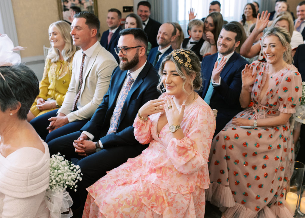Wedding guests react to the emotional ceremony in the Ardilaun Hotel, Galway.
