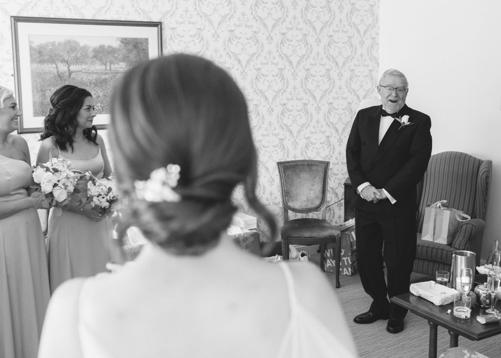 Bride Jenny's first look with father of bride before wedding ceremony, in the Ardilaun Hotel's bridal suite.