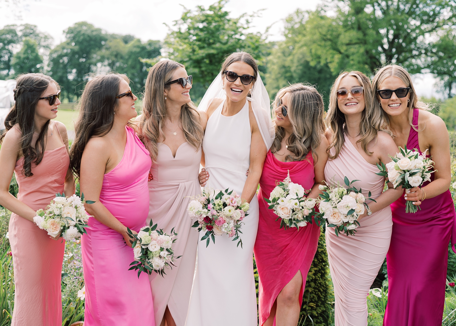 Bride and her bridesmaids styling sunglasses together on her summer wedding day at Tankardstown House.