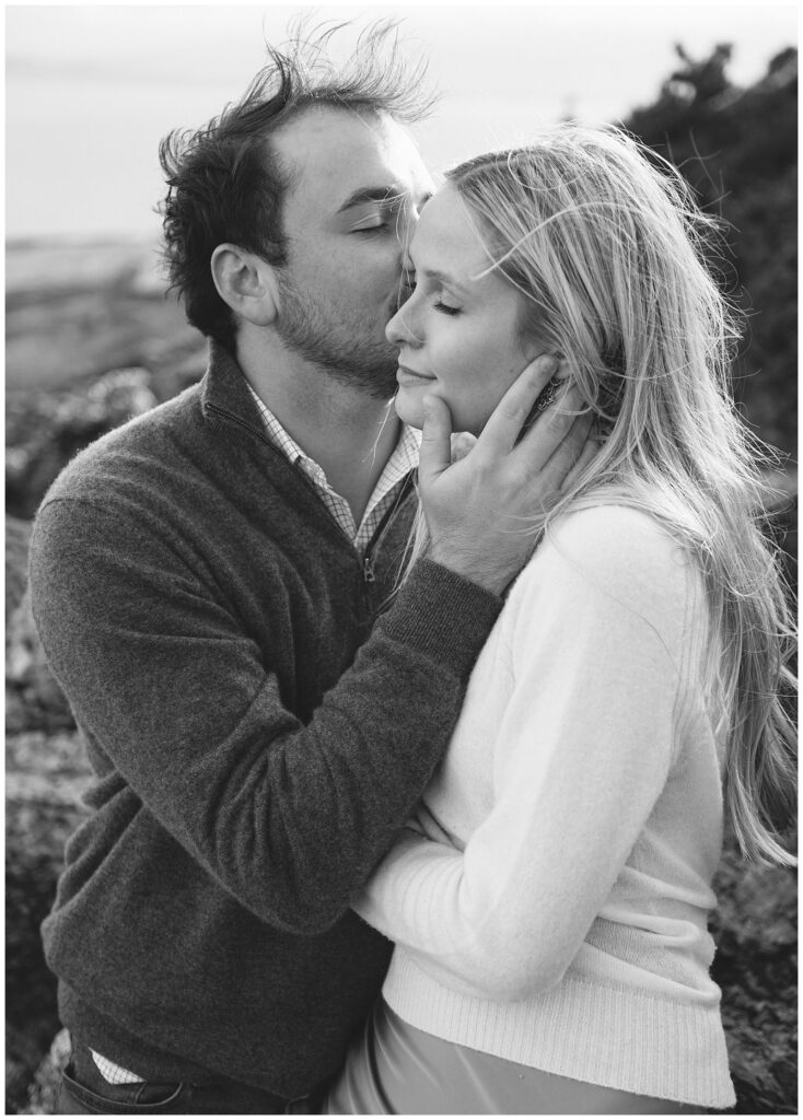 Jacob kisses his fiancée in this emotional black and white portrait in Howth.