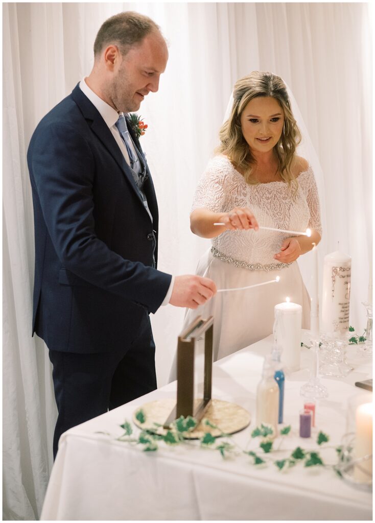 Bride and Groom light their ceremonial candles together during their wedding in Ballinasloe, Galway.
