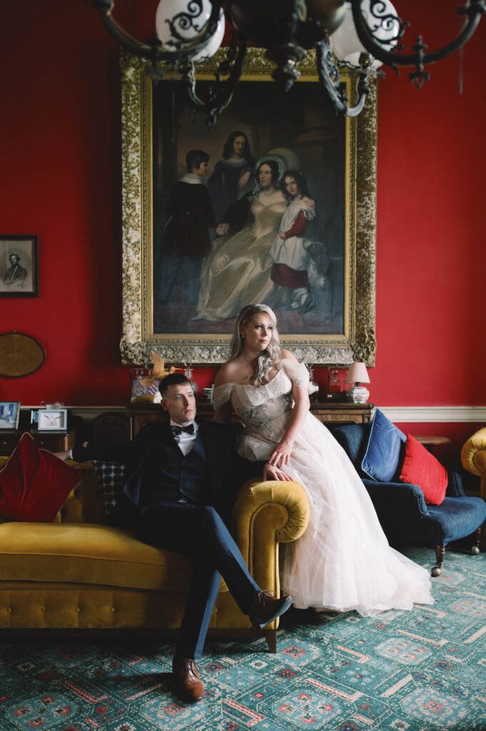 Bride and Groom posing dramatically in the drawing room of Temple House, Sligo.