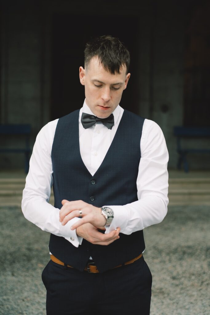 Groom dressed in his waistcoat on the morning of his elopement wedding in Sligo.