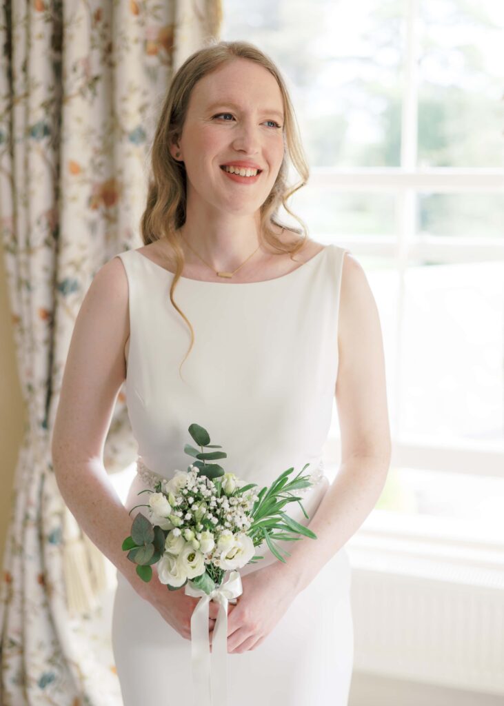 Portrait of the bride in the glow of the Master Suite, Tankardstown House.