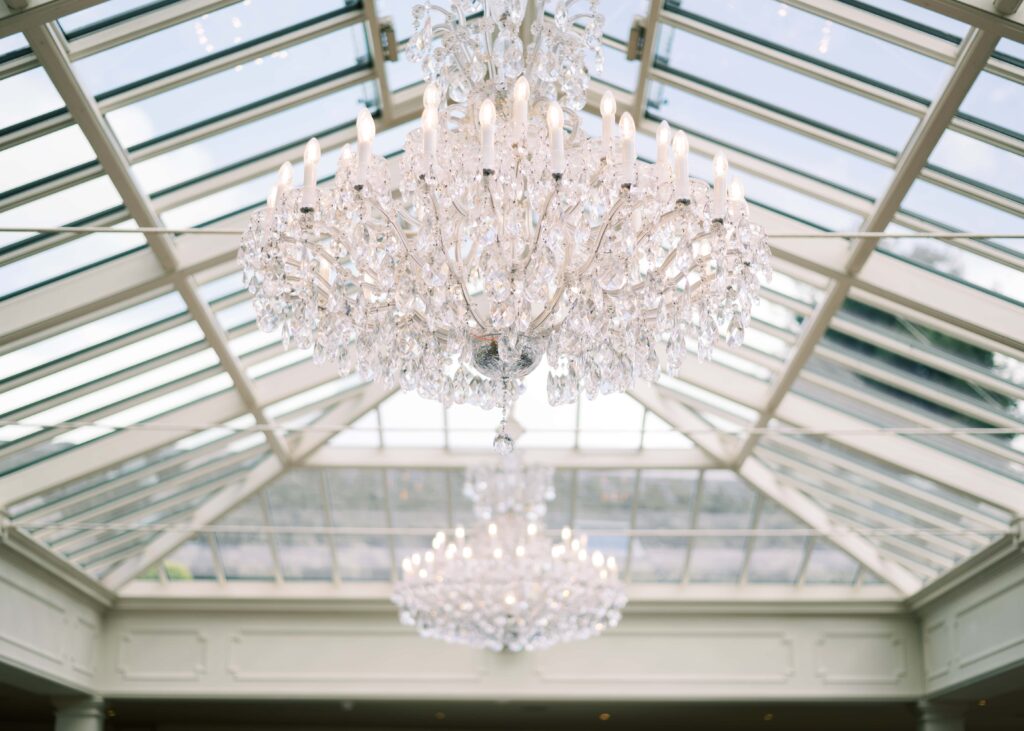Chandeliers hanging in The Orangery at Tankardstown House during a wedding.