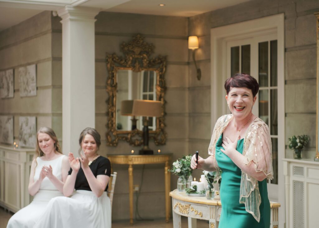 Bride's sister sang during their wedding ceremony in the Orangery.