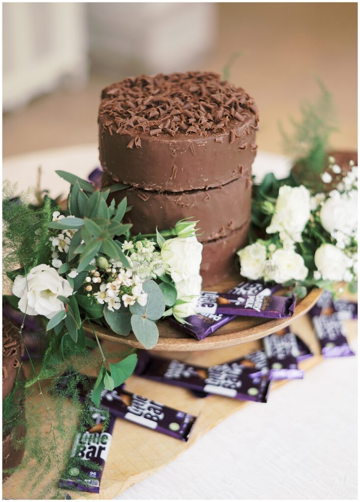 Same-sex wedding couple's favourite chocolate cake with hand-made floral decoration.