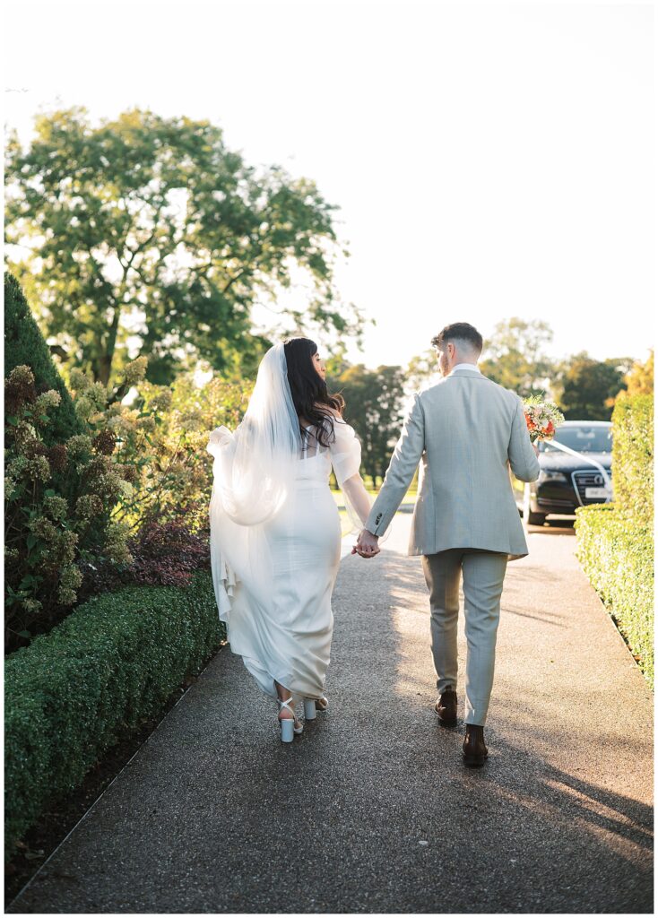 Ireland wedding photography; couple walk together in the light at Tankardstown House.