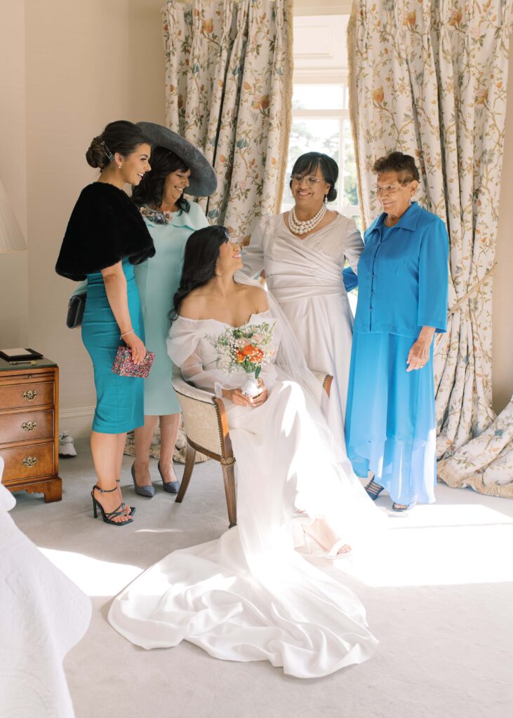 Happy bride surrounded by her family and the groom's family in the bright Tankardstown House.