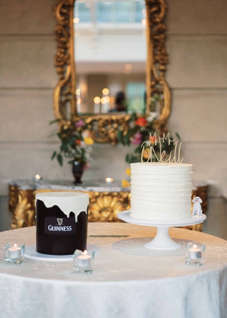 Photo of a Guinness cake and the Wedding cake featuring a toy replica of the couple's dog.