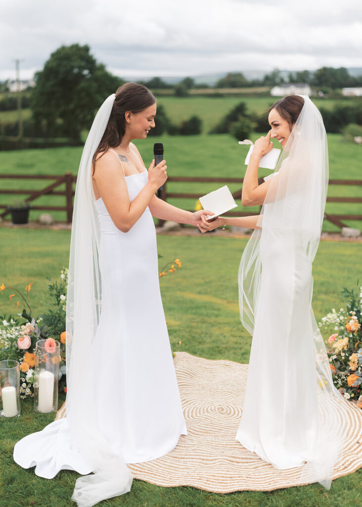 The brides exchange emotional vows and are married in their family garden.