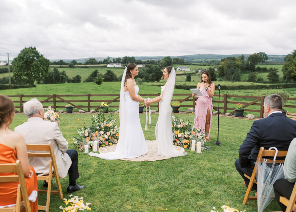 The two brides tie the knot and are married in their garden in the Irish countryside.