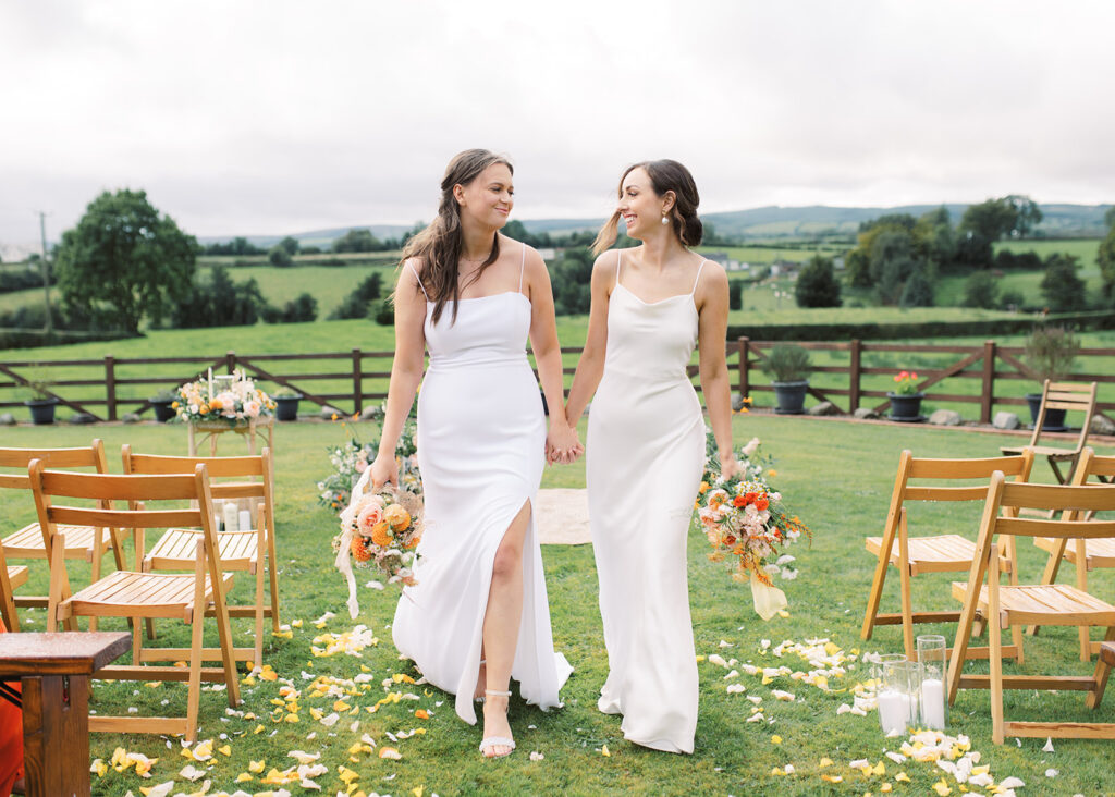 Portrait of the two brides on their inspiring garden wedding in the Irish countryside.